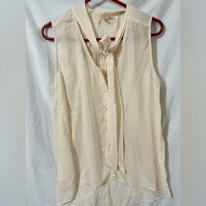 Sheer sleeveless bow tie blouse